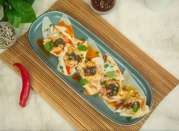 Szechuan Wontons In Chili Oil's image